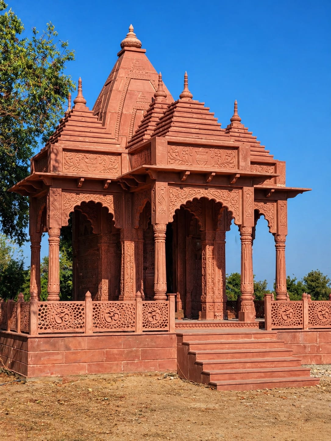 "pink sandstone temple handcrafted design"