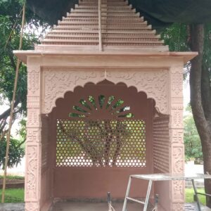 medium size garden temple carved in pink sandstone with jali screen