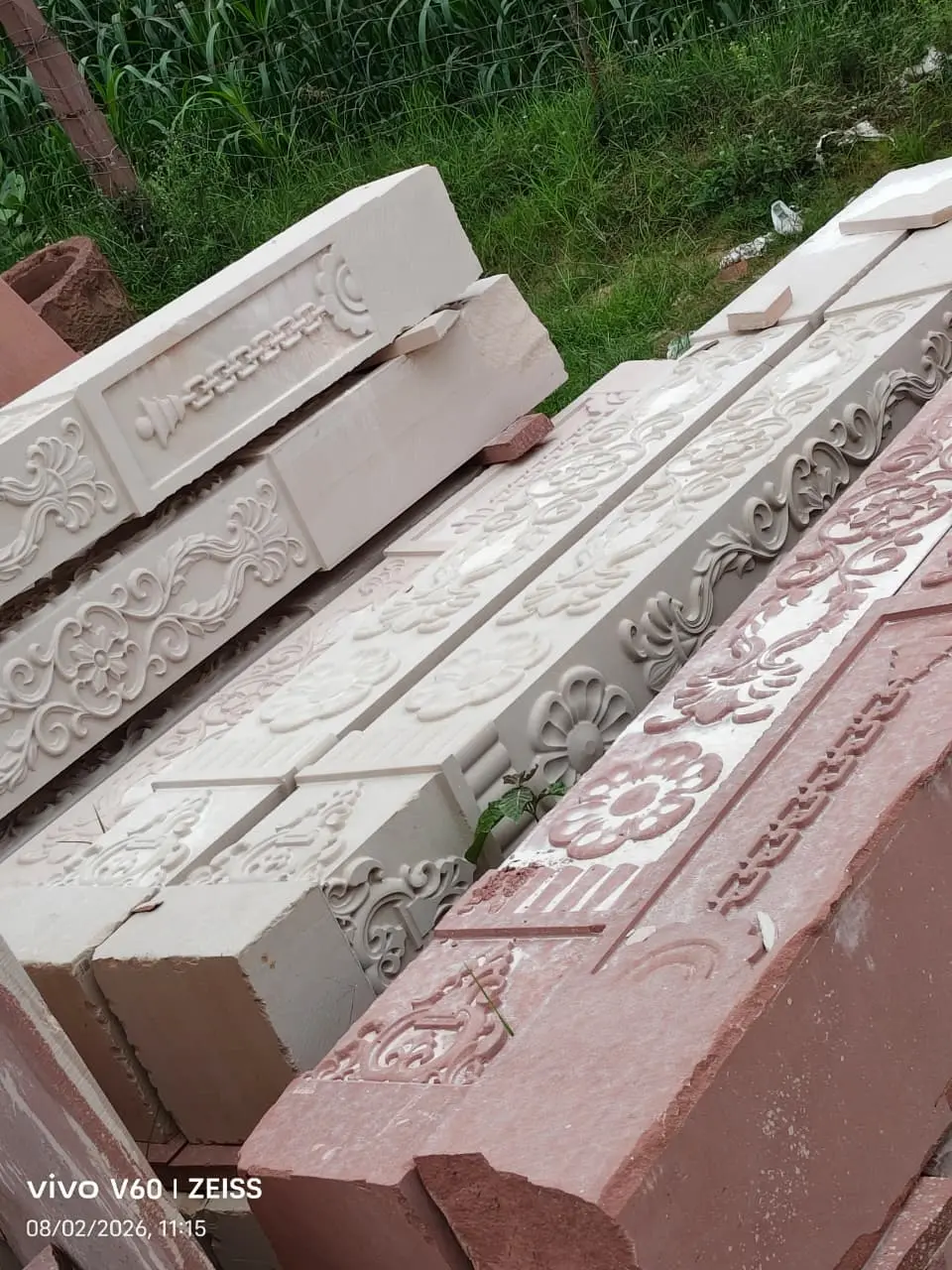Hand carved sandstone temple pillar with ornate bracket