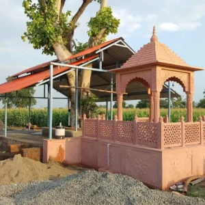 Red stone chhatri with carved pillars and decorative jali work