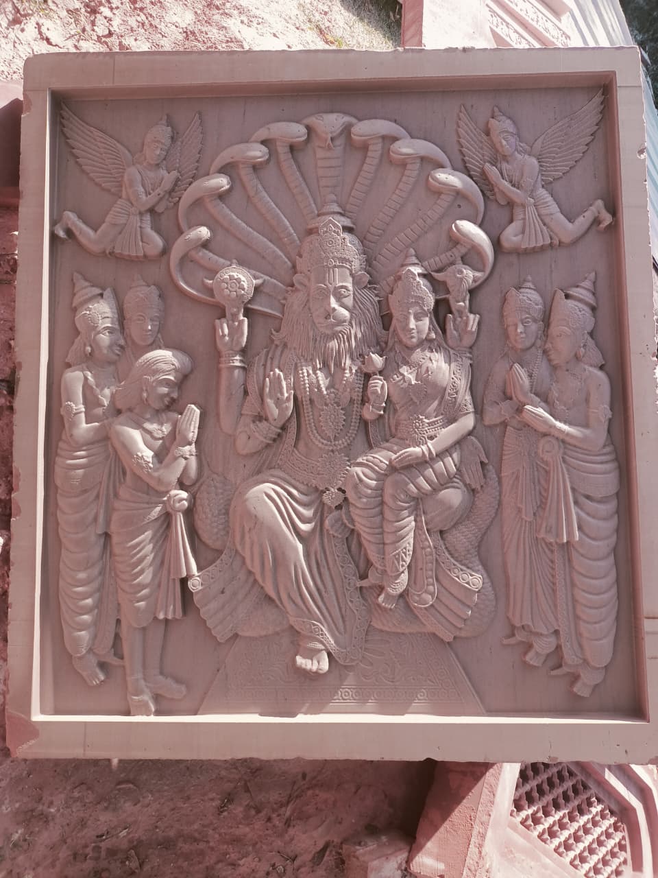 Handcrafted stone panel with traditional Indian carved artwork